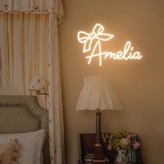 a bedroom with a bed, lamp and window in the background that says ameli