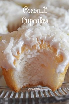 coconut cupcakes with icing on a glass plate