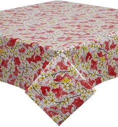 a red table cloth with yellow and white flowers on it, against a white background