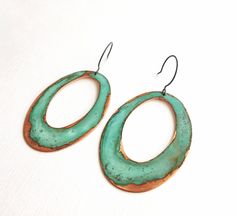 "Copper ovals have been oxidized using our verdigris patina.  Earrings are 3\" log and hang from oxidized sterling ear wires. ssd jewelry © 2017 Please not that the patina process is an organic process and shades of green will vary.   All of our items are HANDMADE and made to order and may take up to approx. 2 weeks to fabricate (not including shipping time).  During the holiday season fabrication time might take up to 3 weeks.  We are happy to expedite your shipping for an additional charge.  P Enameled Jewelry, Patina Jewelry, Wake Forest Nc, Patina Earrings, Handmade Clay Jewelry, Wake Forest, Enamel Jewelry, Fall 2017, Chandelier Earrings