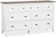 a white dresser with wooden top and drawers on it's sides, against a white background