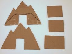 cut out pieces of cardboard sitting next to each other