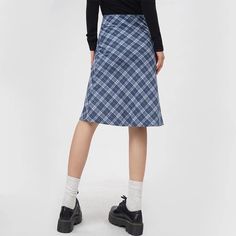 This midi skirt features a classic blue plaid pattern in an A-line silhouette. It has a fitted waistband and falls to the knee, offering a clean, structured look Size:• S: Waist: 64cm/ 25.2 in, Length: 63cm/ 24.8 in• M: Waist: 68cm/ 26.8 in, Length: 64cm/ 25.2 in• L: Waist: 72cm/ 28.3 in, Length: 65cm/ 25.6 inMaterial: Polyester Blue Pencil Skirt For Workwear In Fall, Blue Fall Pencil Skirt For Work, Plaid Cotton Skirt For Work, Casual Blue Knee-length Mini Skirt, Blue Knee-length Casual Mini Skirt, Casual Plaid Skirt For Work, Casual Midi Length Pencil Skirt, Plaid Midi Skirt With Lined Detail, Plaid Midi Skirt With Lining