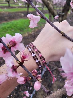 These lovely bracelets are inspired by the beautiful almond blossoms that bloom all over my hometown during the springtime. I've made the bracelet adjustable! Be careful when wearing around water, as friendship bracelets can curl up sometimes. Pink Bohemian Bracelets For Spring, Resizable Bracelets For Spring, Casual Friendship Bracelets For Spring, Casual Spring Friendship Bracelets, Casual Spring Friendship Bracelets As Gifts, Casual Spring Friendship Bracelets Gift, Pink Friendship Bracelets For Spring, Bohemian Beaded Bracelets For Friendship In Spring, Bohemian Beaded Bracelets For Friendship And Spring