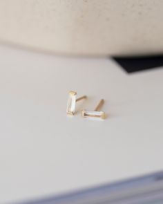 Beautiful and Elegant Dainty Earrings - Perfect 14k gold infinity studs for your everyday wear.Wear it while showering, swimmingall day, everyday◦ Cubic zirconia measures 6x2mm◦ 14k gold including the backings◦ Closure: 14k gold Push backings◦ 1 Pair 14k Gold Earrings With Baguette Diamonds For Everyday, Everyday 14k Gold Earrings With Baguette Diamonds, Minimalist 14k Gold Baguette-cut Earrings, Baguette Earrings, Baguette Earring, Diamond Baguette, Dainty Earrings, Cz Diamond, Baguette Diamond