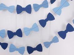 blue paper bow garland hanging on the wall