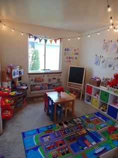 a child's playroom with toys and lights