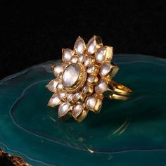 White Flower Ring Riana by Shikha Jindal - Fabilicious Fashion Traditional Yellow Gold Flower Ring For Gift, Traditional Yellow Gold Flower Ring As Gift, Traditional Yellow Gold Flower Ring Gift, Traditional Yellow Gold Flower Ring, Traditional Gold Flower Ring For Festive Occasions, Festive Gold Jewelry With Flower Decoration, Jadtar Ring, White Flower Ring, Indian Fashion Jewellery