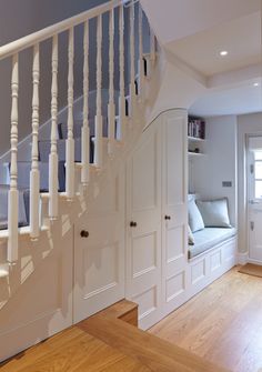 an image of a house with stairs and built - in bookshelves on the wall