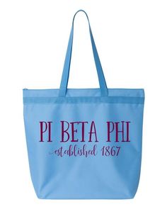 a blue tote bag with the words pi beta phi established 1876 on it