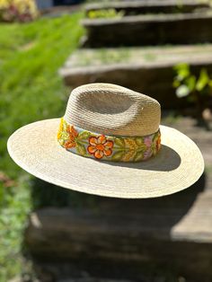 Our Mexican, high quality Artisal Palm Hat, comes with a removable hand embroidered band.  The band is embroidered by Female Artisans of the Andes in Perú.  This classic wide brim hat has sturdy weave to be used in the beach and all adventures in the sun.  Great sun protection.  The close-weave material in this product offers UPF 50+ which blocks 97.50% of the sun's UV rays. One size Handwoven Artisan Hat For Spring, Artisan Handwoven Spring Hat, Embroidered Wide Brim Summer Hat, Summer Wide Brim Embroidered Hats, Summer Brimmed Hats With Embroidery, Summer Embroidered Short Brim Hat, Embroidered Summer Hat With Short Brim, Summer Embroidered Wide Brim Hat, Woven Curved Brim Fedora For Festivals