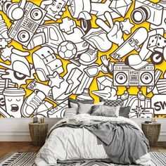 a bedroom with yellow and white wallpaper that has various items on it, including a bed