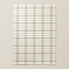 a white and black plaid napkin on top of a table