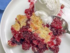 a white plate topped with a piece of pie and ice cream on top of it