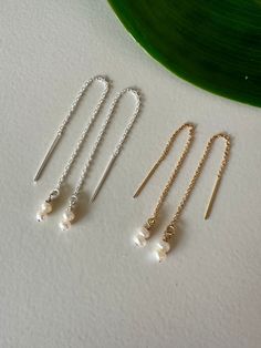 Tiny white pearls on sterling silver or 14k gold filled threaders.  Select your metal and length at checkout. White Long Drop Pearl Earrings In 14k Gold Filled, White Long Drop Pearl Earrings In 14k Gold, Nickel-free 14k Gold Filled Threader Earrings As Gift, Dainty Sterling Silver Pearl Chain Earrings, Dainty Linear Earrings With Pearl Charm For Gift, Sterling Silver Long Drop Pearl Charm Jewelry, Minimalist Sterling Silver Pearl Chain Earrings, Nickel-free Adjustable Pearl Earrings For Everyday, Adjustable Nickel-free Pearl Earrings For Everyday