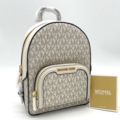 Brand New With Tag Michael Kors Jaycee Xs Mini Convertible Zip Pocket Backpack Crossbody Pvc Leather Mk Signature Color: Light Cream Multi Gold Tone Hardware Michael Kors Logo On Front 1 Zip Pocket At Front Zip Top Closure Custom Fabric Lining 2 Slip-In Pockets 7" (L) X 9' (H) X 3' (D) 2" Top Handle & Adjustable Backpack Straps White Luxury Backpack With Removable Pouch, Luxury White Backpack With Removable Pouch, Luxury White Backpack For Errands, Michael Kors White Travel Backpack, Michael Kors White Standard Backpack, Michael Kors White Backpack For Daily Use, White Michael Kors Backpack For Everyday, Luxury Michael Kors White Backpack, White Crossbody Travel Backpack