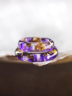 Introducing our Purple Resin Ring--a wearable masterpiece handcrafted for everyday elegance and personal style. This unique Artisan Ring, made with care and creativity, stands out with its captivating shade of purple.  At Foxy Studio, we take pride in offering Handmade Jewelry that reflects individuality. Each Resin Ring is a one-of-a-kind creation. Explore our Etsy Jewelry collection for affordable Gift Ideas for Her, all under $50, and make a statement with enduring pieces that last. Embrace t Handmade Gold Stackable Promise Rings, Gold Handmade Stackable Promise Rings, Handmade Toe Ring Jewelry Gift, Handmade Toe Ring Jewelry For Gifts, Stackable Open Ring Bracelets As Gift, Minimalist Bangle Rings For Gifts, Nature-inspired Stackable Rings For Gifts, Handmade Gold Stackable Rings For Gifts, Nature-inspired Adjustable Stackable Rings As Gift