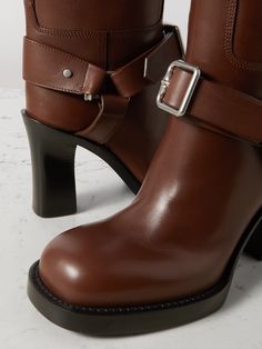 Find BURBERRY Le Stirrup Leather Boots on Editorialist. Burberry's 'Le Stirrup' knee boots are inspired by the label's equestrian heritage. Crafted from leather, they have buckled straps, chunky round toes and the house's archival logo embossed on the soles. Leather Knee Boots, Stirrup Leathers, Low Boots, Burberry Shoes, Stirrups, Burberry Women, Brown Leather Boots, Boots Knee, Black Leather Boots