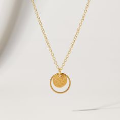 "Double Circle and Hammered Gold Disc Pendant Necklace from OhSoFitting ⭐   Want to get 20% off your first order? Join the Style Club and get a coupon for 20% off sent to your inbox! https://bit.ly/ohsoetsycoupon.⭐ The type of chic necklace never goes out of style! This 16K gold plated double circle pendant comes on a dainty gold chain and looks elegant on its own, or layered with other gold chains, pearls or beads - giving you so many styling options, every season of the year! NECKLACE DETAILS ⚬ 16K gold plated hammered disc pendant with a matte finish inside a matte gold plated circle. ⚬ Pendant is 5/8\". ⚬ 16\" 18K gold plated chain, nickel-free and hypoallergenic. QUESTIONS? Just use the \"Message Merrie\" button below and I'll be happy to help! Thanks for shopping at OhSoFitting!" Sterling Silver Circle Necklaces Tarnish Resistant, Tarnish Resistant Sterling Silver Circle Necklaces, Nickel Free Yellow Gold Pendant Necklace, Nickel-free Yellow Gold Pendant Necklace, Brass Circle Necklace For Gifts, Nickel-free Yellow Gold Necklace, Nickel-free Gold-plated Necklace With Round Pendant, Gold Plated Nickel-free Necklace With Round Pendant, Nickel-free Gold Plated Necklace With Round Pendant