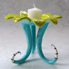 a candle holder with two candles in it