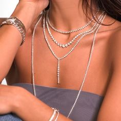 It's time to treat yourself to the one you've always wanted. Whether with a white tee or a gala dress this piece will impress. Our graduated tennis necklace made with 96 diamonds in a total of 20.38ct t.w round cut diamonds. Set in 18K White Gold. With Insert Clasp with fold-over security closure. 18K Gold: 28.38gr Diamonds: 3.75ct - 99 pieces Length: 18 in Width: 4mm Available in White Gold Natural, untreated gemstones Contact us to further customize SKU: TN0049 Formal Tennis Necklace With Rhinestones, Elegant White Tennis Necklace With Rhinestones, Elegant White Rhinestone Tennis Necklace, Fine Jewelry White Gold Tennis Necklace For Party, White Gold Fine Jewelry Tennis Necklace For Party, White Gold Tennis Necklace For Party, Luxury White Gold Tennis Necklace For Party, White Rhinestone Tennis Necklace, Elegant White Tennis Necklace For Party