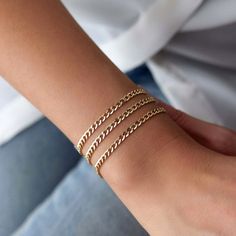 Our very simple and elegant plain chain bracelet. This chain bracelet is ideal for minimalists. Because we craft our pieces with real 14k solid gold, you can enjoy this delicate piece with a free mind every day. Our elegant bracelet is crafted with real 14k solid gold(not plated, not vermeil, not gold filled) The bracelet measure 3. 2 mm in width Since we work with real gold, you can enjoy this piece with a free mind without the worry of water, conditioner or alcohol contact. Real gold keeps its Minimalist 14k Gold Charm Bracelet With Delicate Chain, Minimalist Yellow Gold Jubilee Charm Bracelet, Minimalist 14k Gold Charm Bracelet With Adjustable Chain, Dainty Everyday Chain Bracelet With Curb Chain, Minimalist 14k Gold Curb Chain Bracelet, Dainty Curb Chain Bracelet For Everyday, Dainty Everyday Curb Chain Bracelet, Simple 14k Yellow Gold Bracelets, Minimalist 14k Gold Filled Bracelet With Adjustable Chain