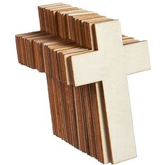 a cross made out of wood on a white background