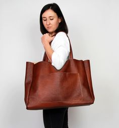 "Cognac brown leather tote - large leather tote bag This brown large tote bag is made from high quality italian leather. Spacious interior provides room for all the daily essentials and more. There is an inside zippered pocket. This bag is perfect as your everyday bag, which can fit an IPAD, A4 files, books, magazines, cosmetic bag as well as many accessories. Additional large slip pocket at the front of the bag. Height: 39 cm / 15.4\" Max width at the top: 61 cm / 24\" Width at the base: 51 cm Large Brown Rectangular Satchel, Large Rectangular Brown Satchel, Large Brown Shoulder Bag For Errands, Large Brown Satchel For Daily Use, Everyday Large Brown Satchel, Brown Large Satchel For Everyday Use, Large Brown Satchel For Everyday Use, Large Brown Everyday Bags, Large Brown Everyday Bag