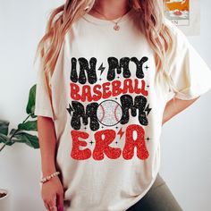 a woman wearing a t - shirt that says in my baseball mom era