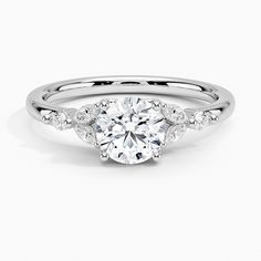 a white gold engagement ring with diamonds on it