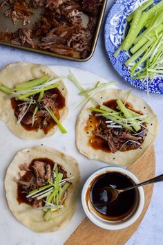 four pulled pork tortillas with sauce and green beans