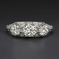 an antique three stone diamond ring