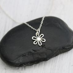 Tiny Sterling Silver Daisy Charm with Open Petals Necklace. This sweet daisy pendant has open petals making it light and airy and perfect to be worn in a garden wedding. Perfect for the bride, bridesmaids or flower girl! » Sterling Silver Tiny Daisy with Open Petals (14mm including jump ring x 10mm) with tiny 925 genuine Sterling mark on back. » Sterling Silver Cable Chain (select from drop-down on upper right) » Your jewelry purchase will come beautifully packaged for gift giving. Personalize I Garden Wedding Flowers, Daisy Pendant, Daisy Charm, Daisy Necklace, Floral Jewelry, Flower Girl Gifts, Wedding Flower Girl, Floral Necklace, Floral Jewellery