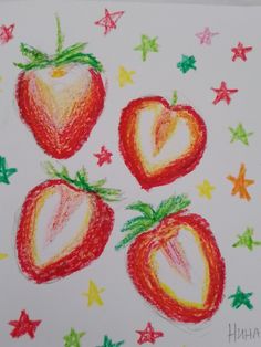 a drawing of three strawberries on a white paper with stars and hearts around them