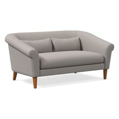 a gray couch with wooden legs on an isolated white background