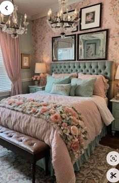 a bedroom decorated in pink and green with chandelier above the bed, flowers on the bedspread