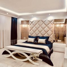 a modern bedroom with white and blue decor