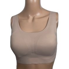 Seamless, Nylon-Blend Stretch Knit Style: Pullover Cup Type: Full Coverage Wide Strap, Non-Adjustable Closure: Pullover Design Features: Removable, Dyed-To-Match Pads Bonded Bottom Band Level 2: Medium Smoothing Support 75% Nylon, 25% Spandex Beige Stretch Sports Bra With Built-in Bra, Fitted Seamless Beige Sports Bra, Fitted Beige Seamless Sports Bra, Beige Stretch Shapewear Bra, Beige Full Coverage Stretch Sports Bra, Beige Sleeveless Seamless Shapewear, Beige Seamless Sleeveless Shapewear, Leisure Bra, Lacey Bra