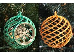 two ornaments hanging from a christmas tree in the shape of an ornament and snowflake