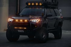 the front end of a vehicle with lights on