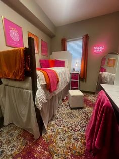 a bedroom with two twin beds and pink accents