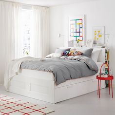 a bedroom with white walls and flooring is shown