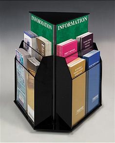 a book holder with several books in it and the cover is folded to show information