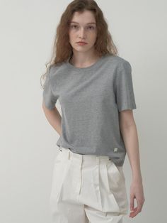 This versatile basic T-shirt is made of high-density 20s cotton material, offering a firm and soft touch with minimal shrinkage. - Exclusive washing process for minimal shrinkage- Reinforced shoulder and neckline with chain stitching- Sturdy double stitching on cuffs and bottom hem Minimalist Crew Neck T-shirt For Work, Classic T-shirt For Workwear, Modern T-shirt For Work, Modern Solid Color T-shirt For Work, Modern Workwear T-shirt, Basic Solid Color T-shirt For Work, Minimalist Solid Color T-shirt, Minimalist Solid Color Everyday T-shirt, Minimalist Solid Color T-shirt For Spring