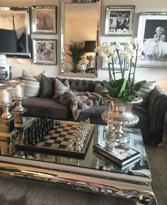 a living room filled with lots of furniture and pictures on the wall next to each other