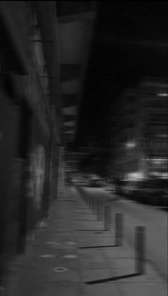 black and white photograph of an empty sidewalk