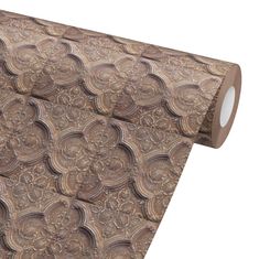 a roll of brown paper with an intricate design on it