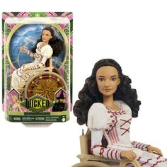 a doll sitting on top of a wooden wheel