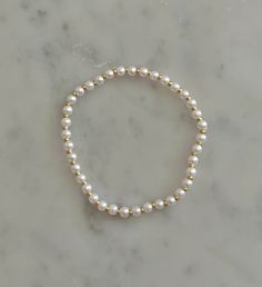 -faux pearls -stretchy bracelet Bracelet Business, Bracelet Pearls, Pearl Beaded Bracelet, Bow Bracelet, Beads Bracelet Design, Bracelet Design, Moon Jewelry, Stretchy Bracelets, Fancy Jewelry