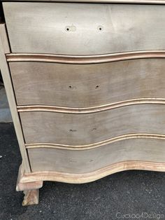 an old dresser is painted white and brown